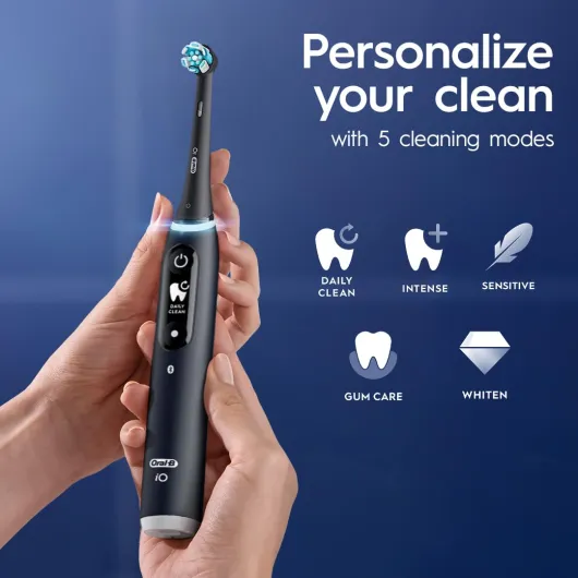 Oral-B iO Deep Clean + Protect Rechargeable Electric Toothbrush, Black with a iO Series 7 Toothbrush, 2 Replacement Brush Heads, and a Charging Travel Case